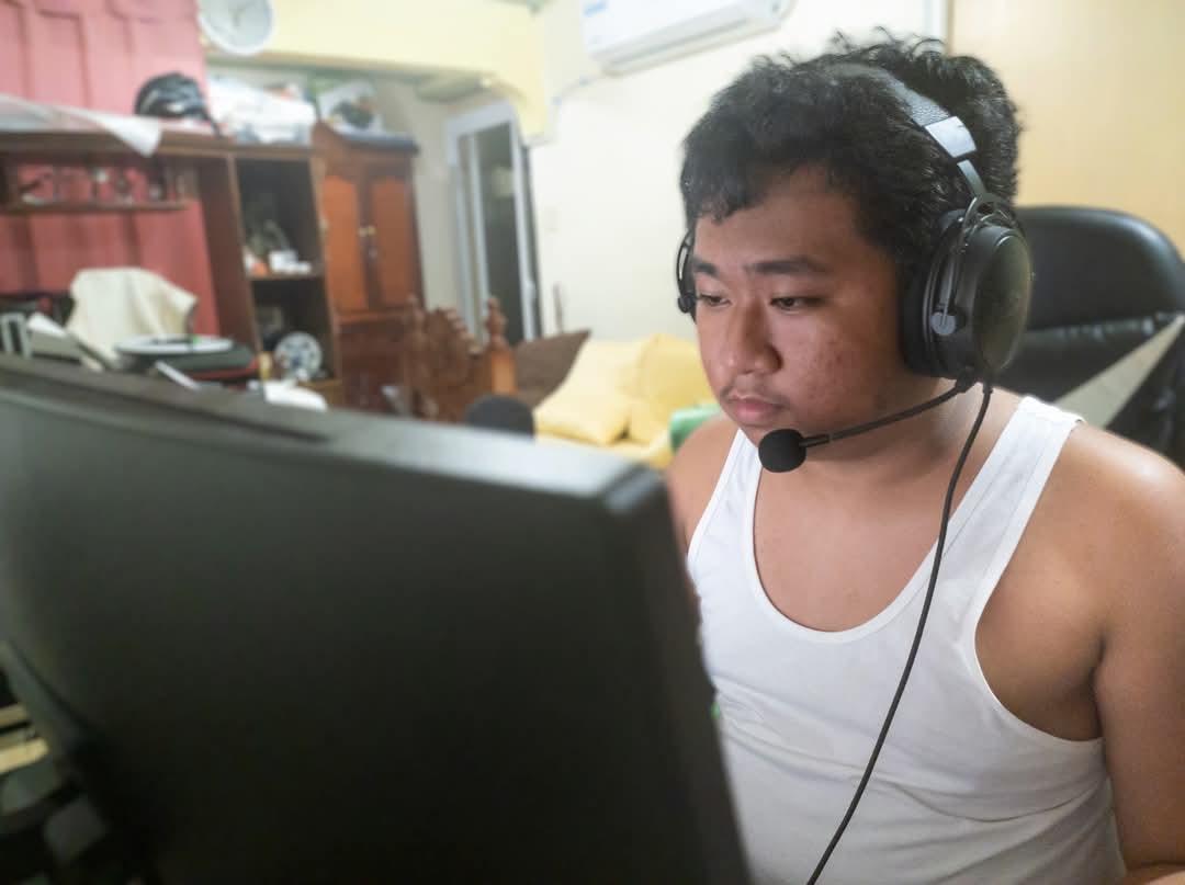 Jason wearing a headset while seated at his computer
