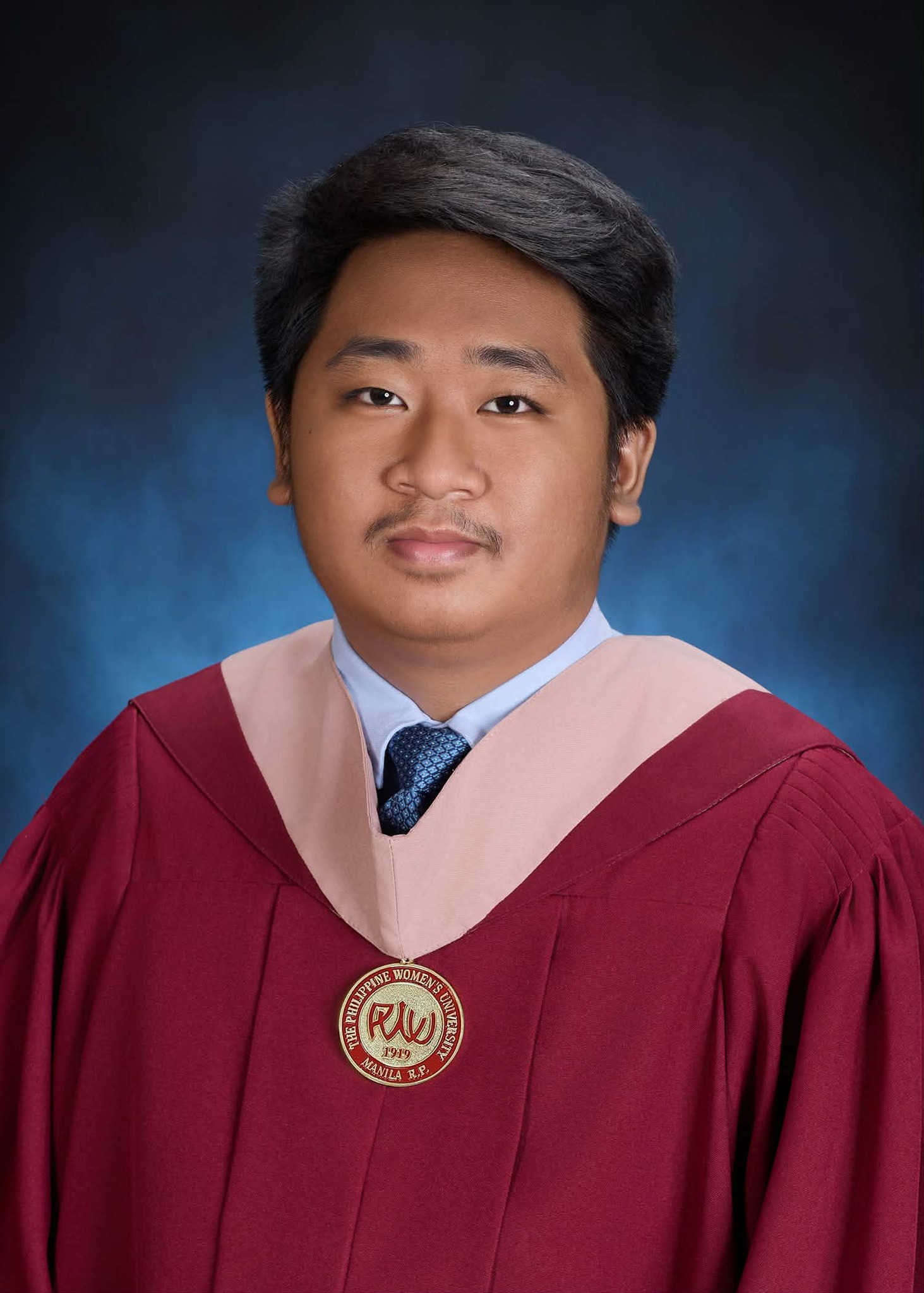 Jason in his Philippine Women's University graduation gown